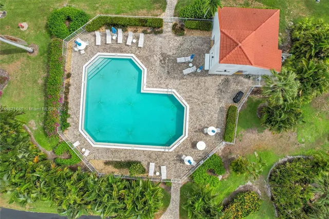an aerial view of lake residential house with outdoor space and trees