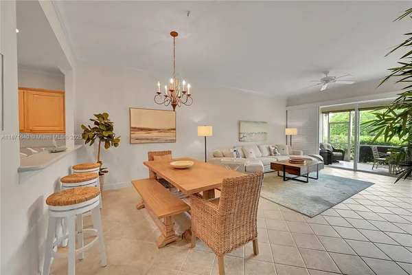 a bedroom with a bed and a ceiling fan