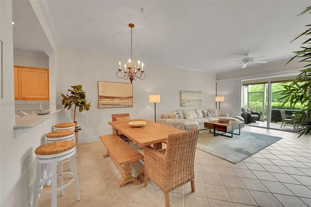 a bedroom with a bed and a ceiling fan