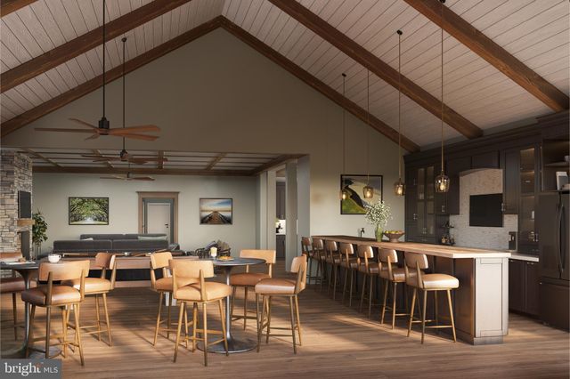 a view of a house with swimming pool and sitting area