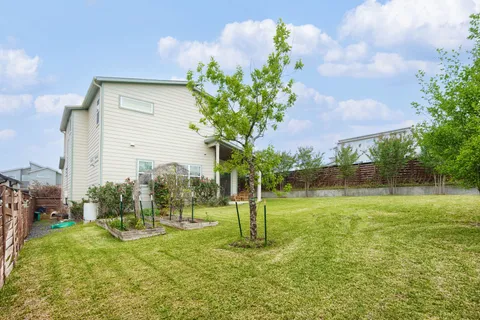 a backyard of a house with lots of green space