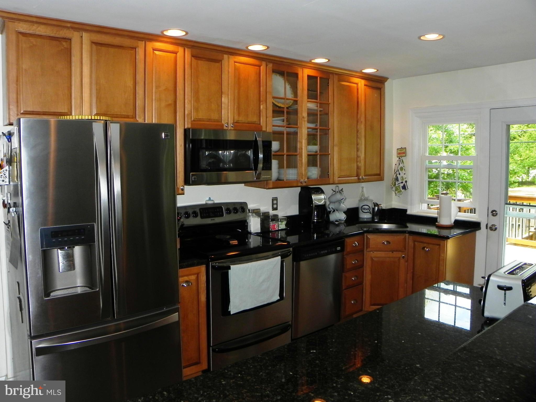234 Blenheim Road Baltimore, MD 21212 - Photo 2 of 16 a kitchen with stainless steel appliances granite countertop a refrigerator and a sink