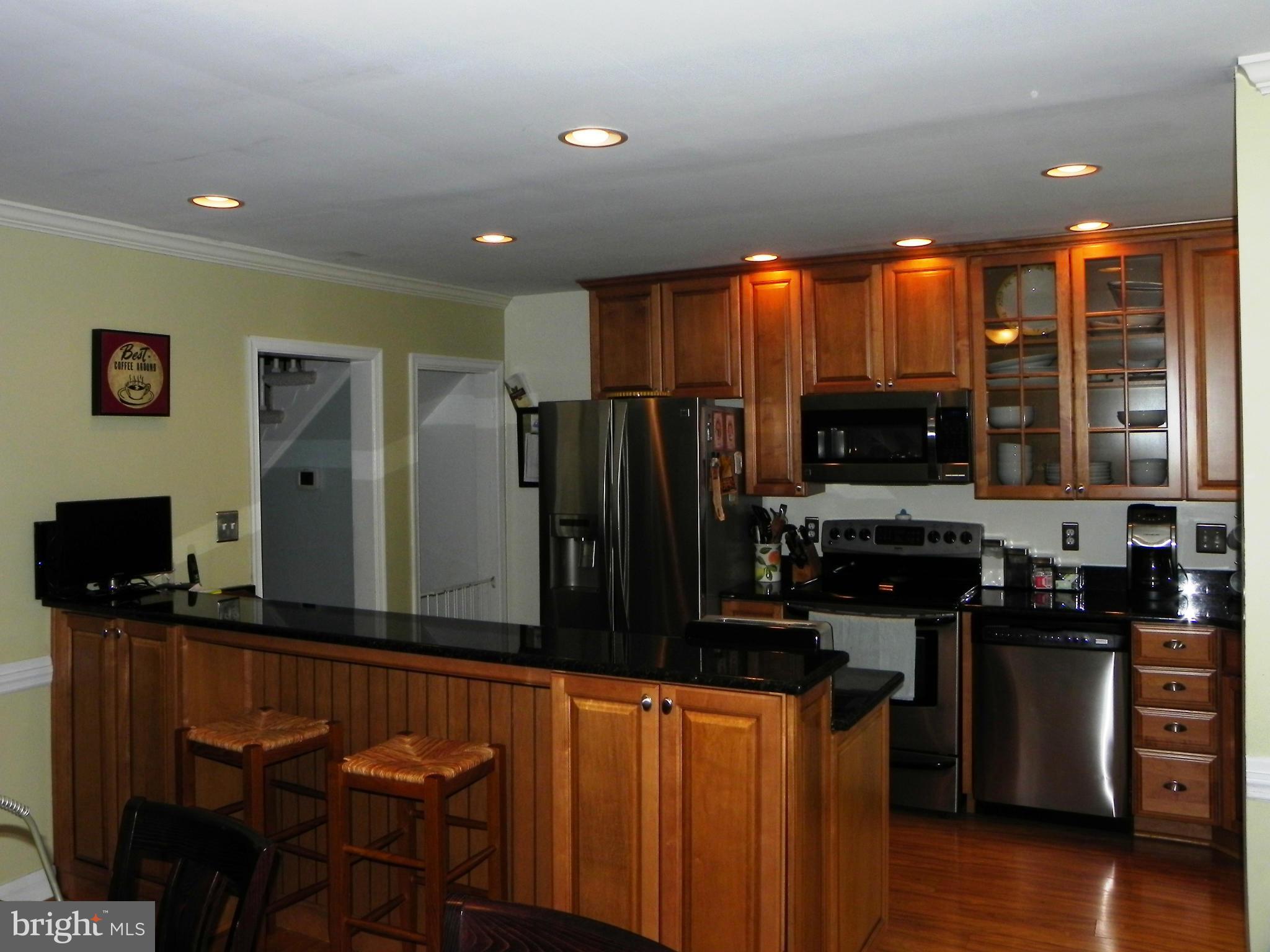 234 Blenheim Road Baltimore, MD 21212 - Photo 3 of 16 a kitchen with stainless steel appliances a microwave a stove and refrigerator