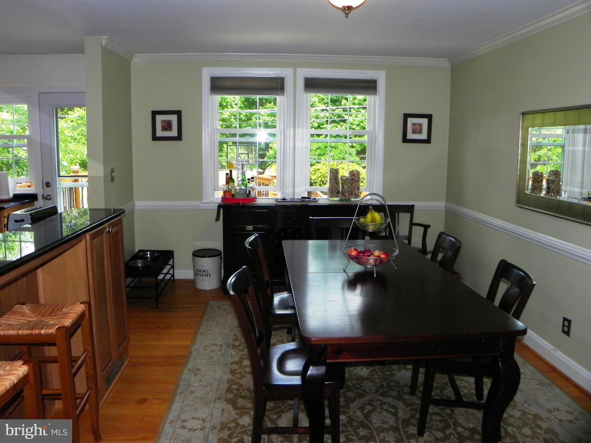 234 Blenheim Road Baltimore, MD 21212 - Photo 4 of 16 a view of a dining room with furniture window and outside view
