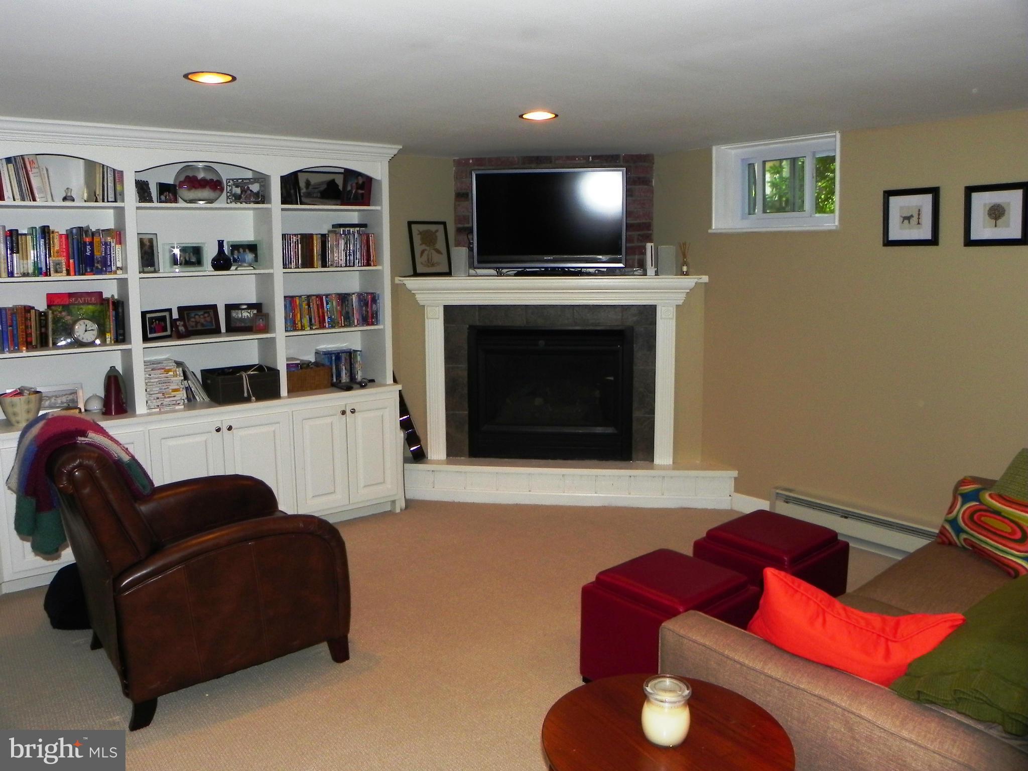 234 Blenheim Road Baltimore, MD 21212 - Photo 7 of 16 a living room with furniture cabinets and a flat screen tv