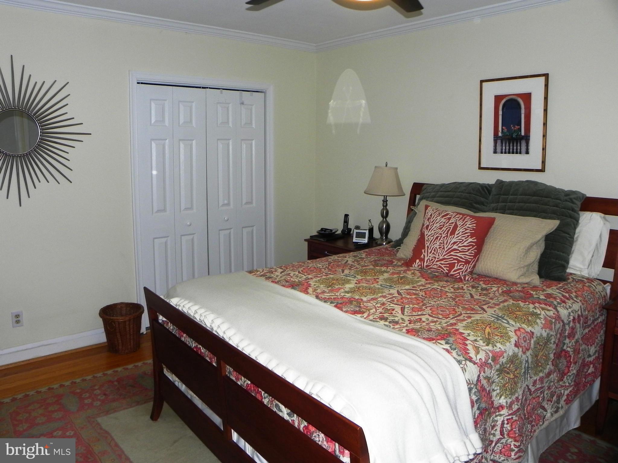 234 Blenheim Road Baltimore, MD 21212 - Photo 10 of 16 a bedroom with a bed and a painting on the wall