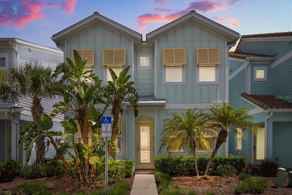8017 Sandy Toes Way Kissimmee, FL 34747 - Photo 1 of 1 a front view of yellow house with a yard