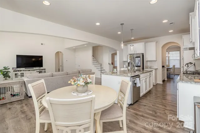an aerial view of a house with garden space and street view