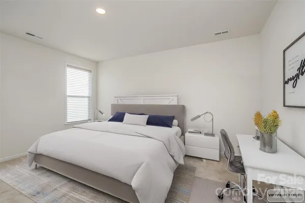 a bedroom with a bed and a cabinets