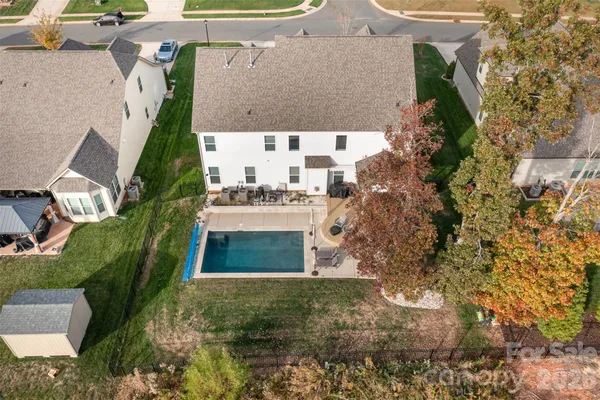 an aerial view of residential houses with outdoor space