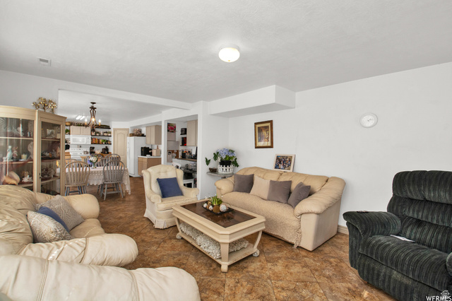 339 North Farm Mdw Road Farmington, UT 84025 - Photo 11 of 17 Open concept living area featuring tile flooring