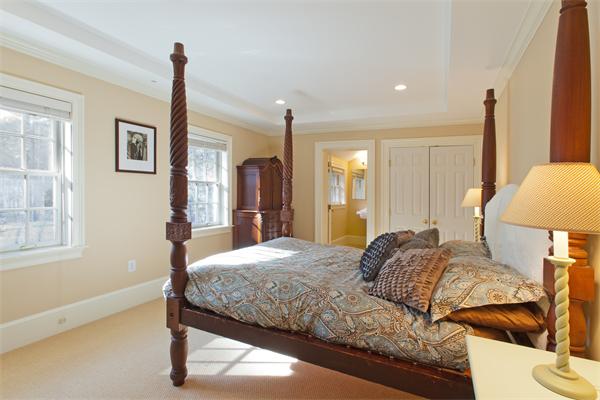 904 Lowell Road Concord, MA 01742 - Photo 19 of 26 a bedroom with a bed and a lamp with window