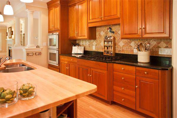 904 Lowell Road Concord, MA 01742 - Photo 8 of 26 a kitchen with stainless steel appliances a sink a counter top space and cabinets