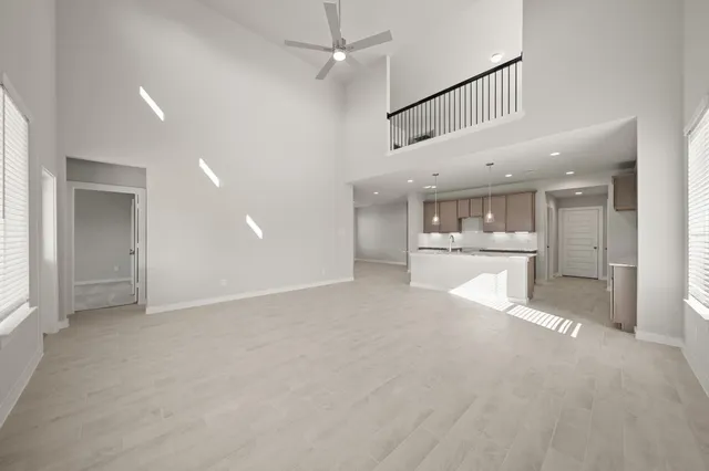 a view of a kitchen with a sink and a window