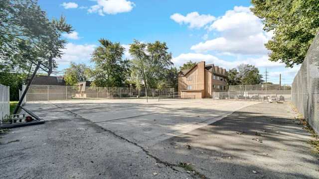 a view of a garden with wooden fence