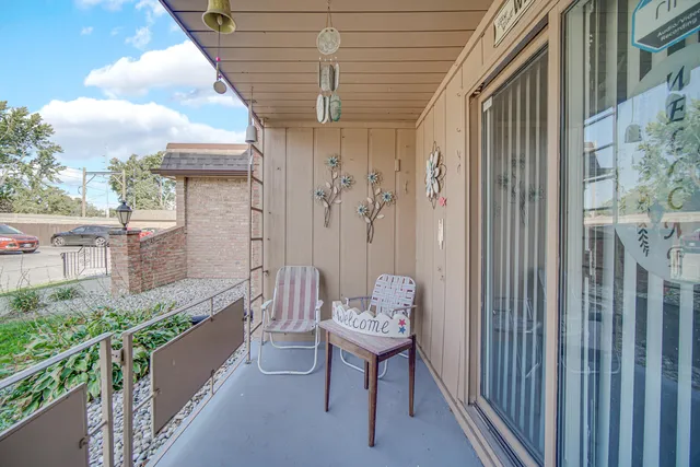 a view of a balcony with furniture