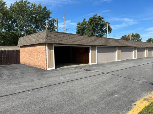 a front view of a house with a garage