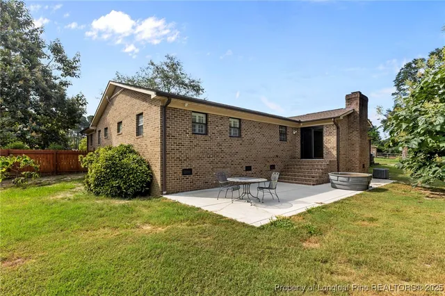 a view of a swimming pool with a yard
