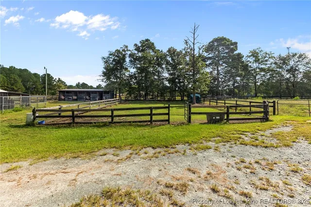 a view of a deck with a big yard