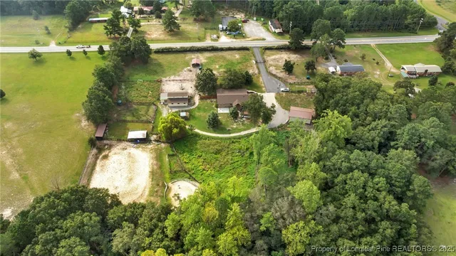 a view of a small pool with a yard