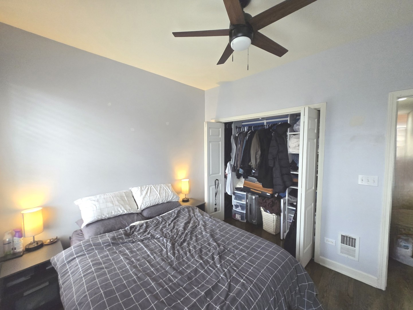 1915 South State Street, Unit 3 Chicago, IL 60616 - Photo 19 of 29 a bedroom with a bed and a chandelier