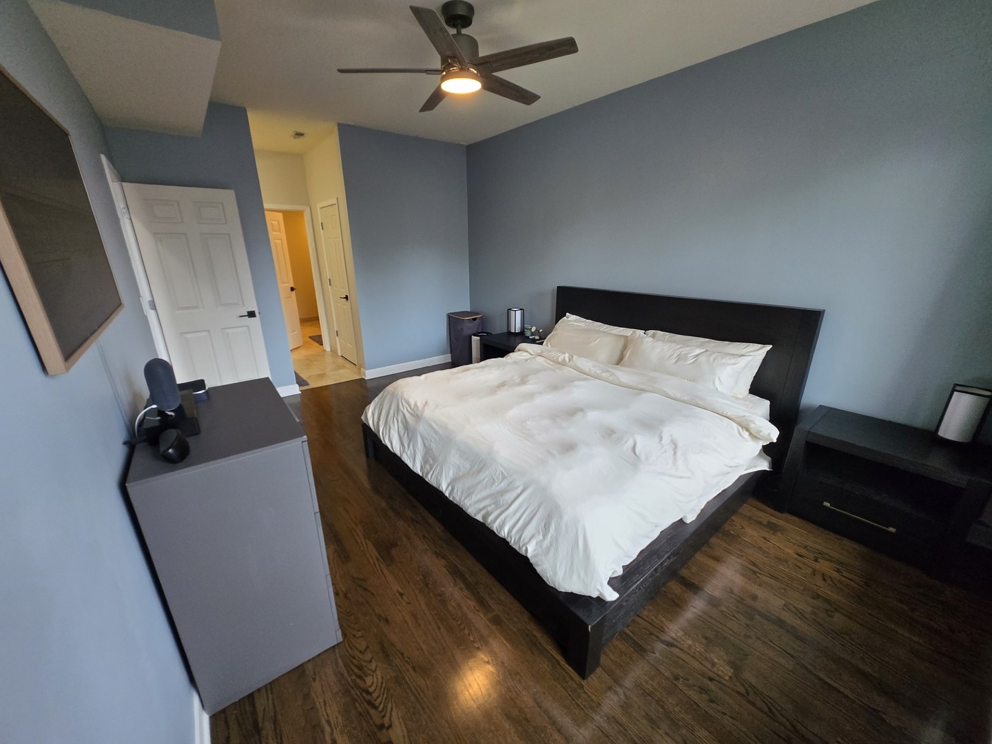 1915 South State Street, Unit 3 Chicago, IL 60616 - Photo 23 of 29 a bed sitting in a bedroom next to a window with pc on the table