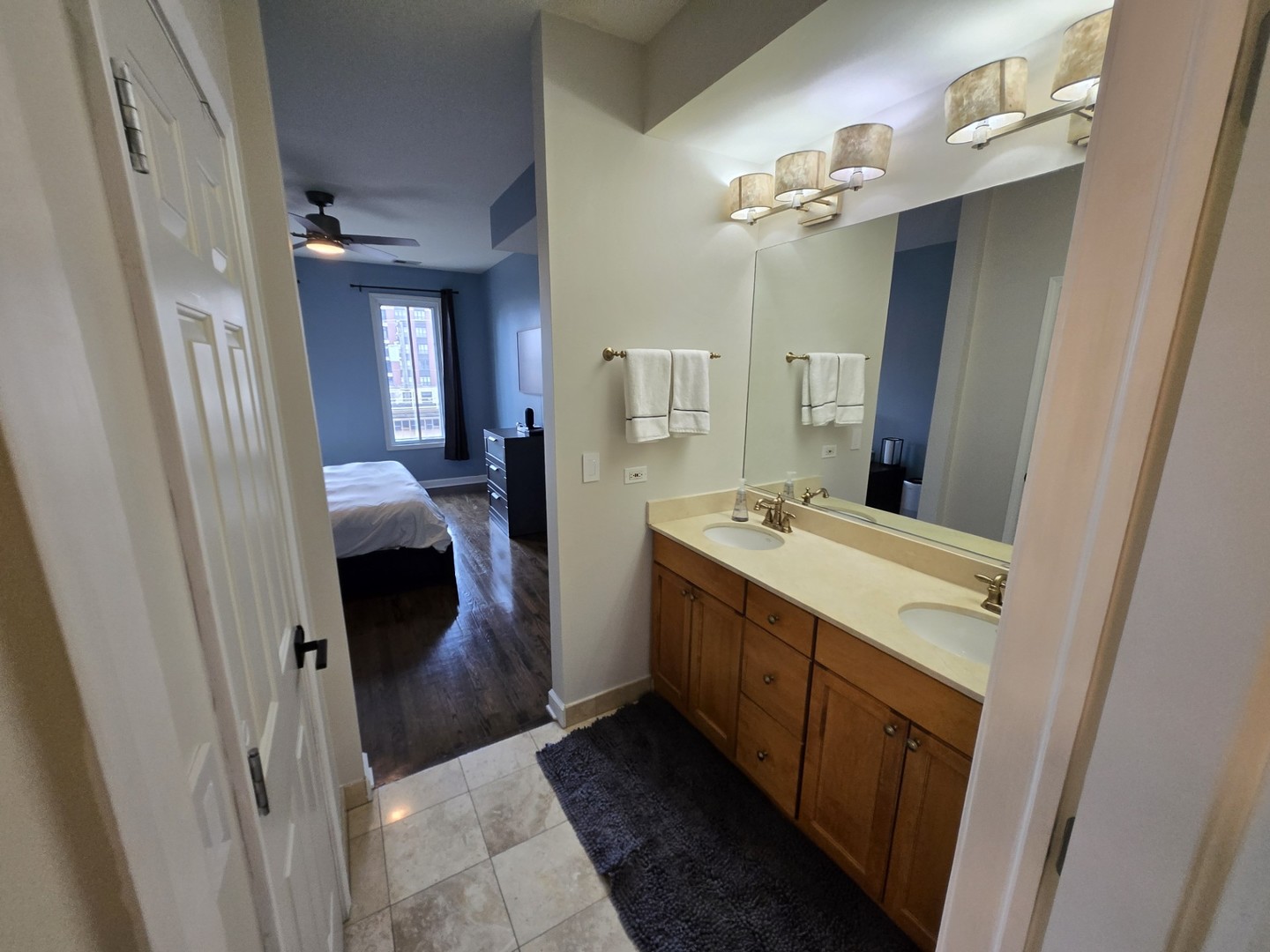 1915 South State Street, Unit 3 Chicago, IL 60616 - Photo 24 of 29 a bathroom with a sink and mirror with bathtub