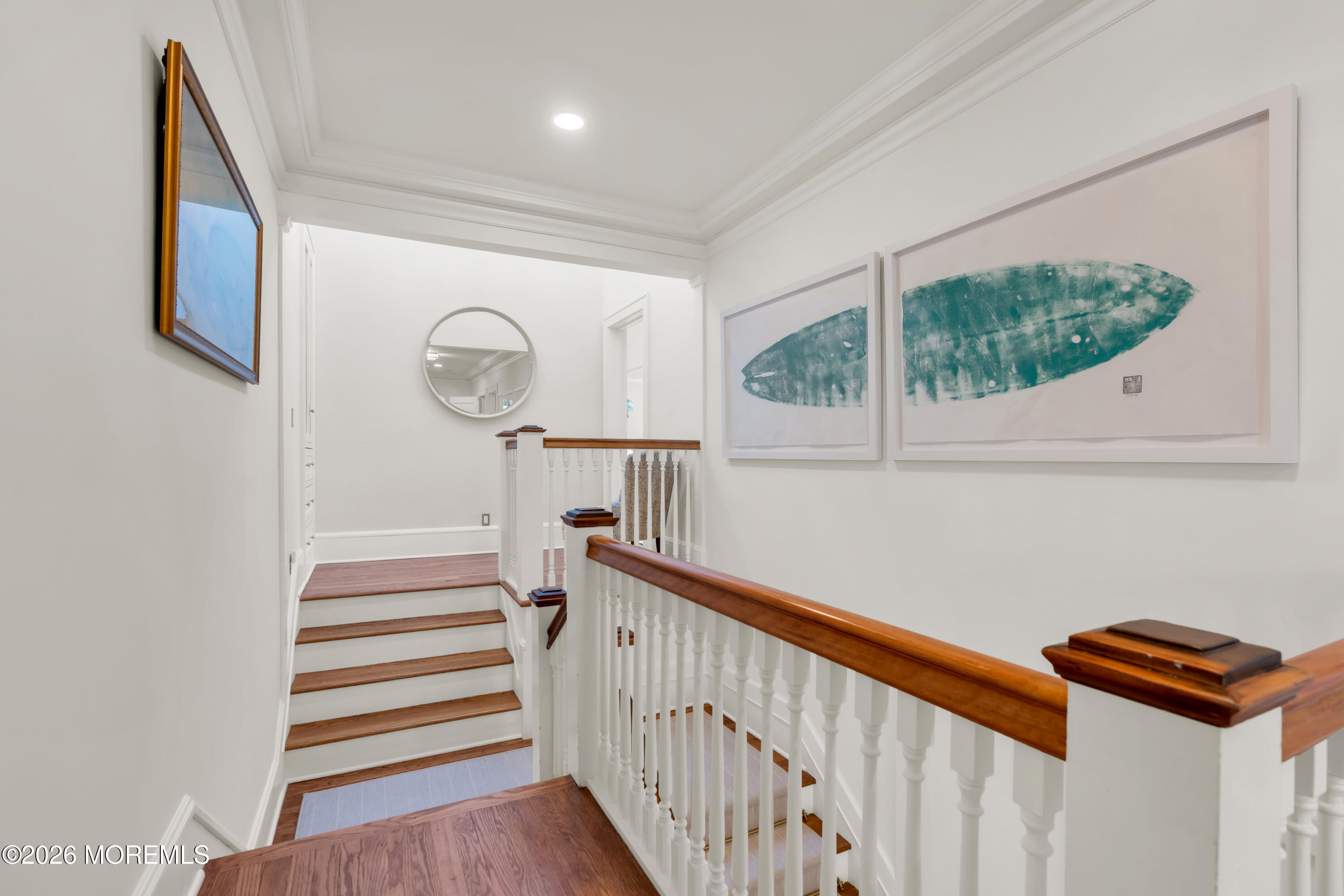 a view of entryway and hall with wooden floor