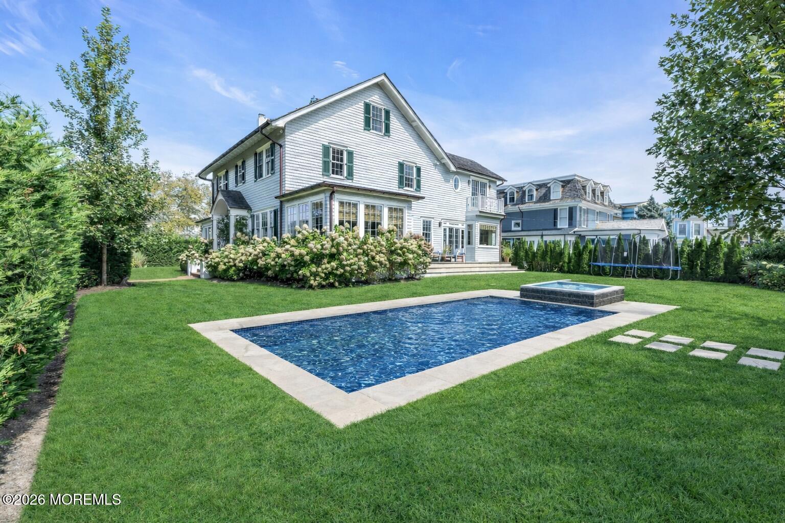 117 Madison Avenue Spring Lake, NJ 07762 - Photo 15 of 96 a front view of a house with garden