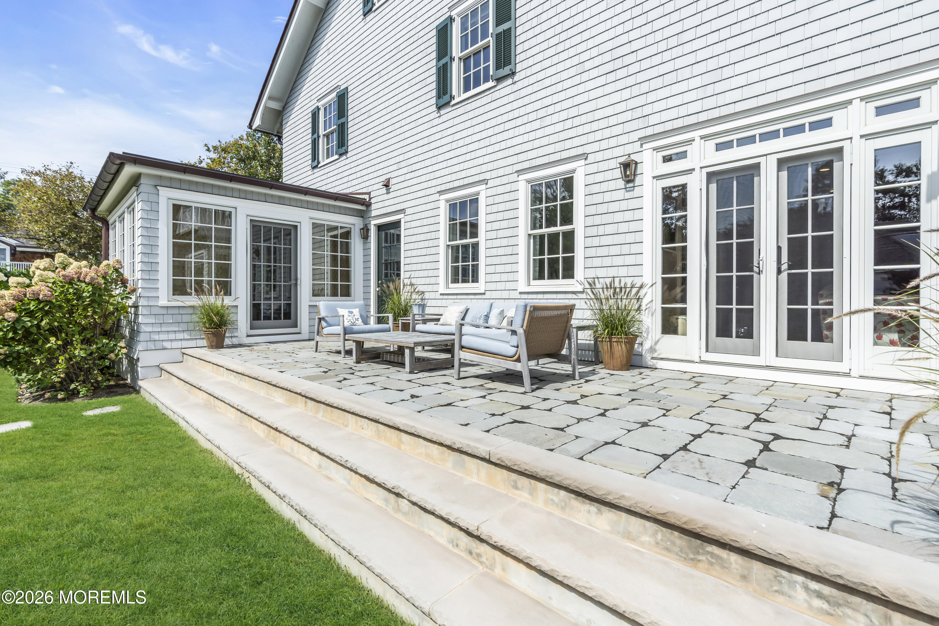 117 Madison Avenue Spring Lake, NJ 07762 - Photo 16 of 96 a view of a dinning table and chairs in patio