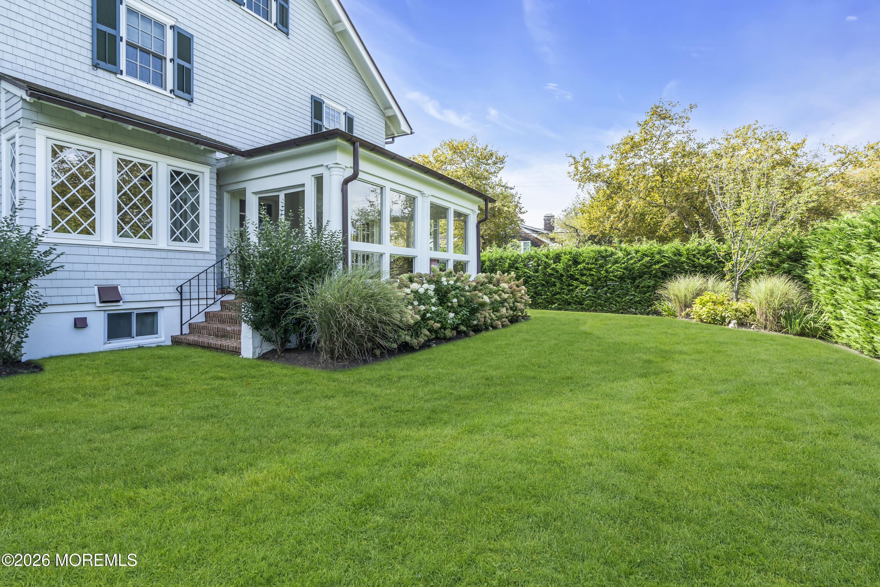 117 Madison Avenue Spring Lake, NJ 07762 - Photo 20 of 96 a front view of house with yard and green space