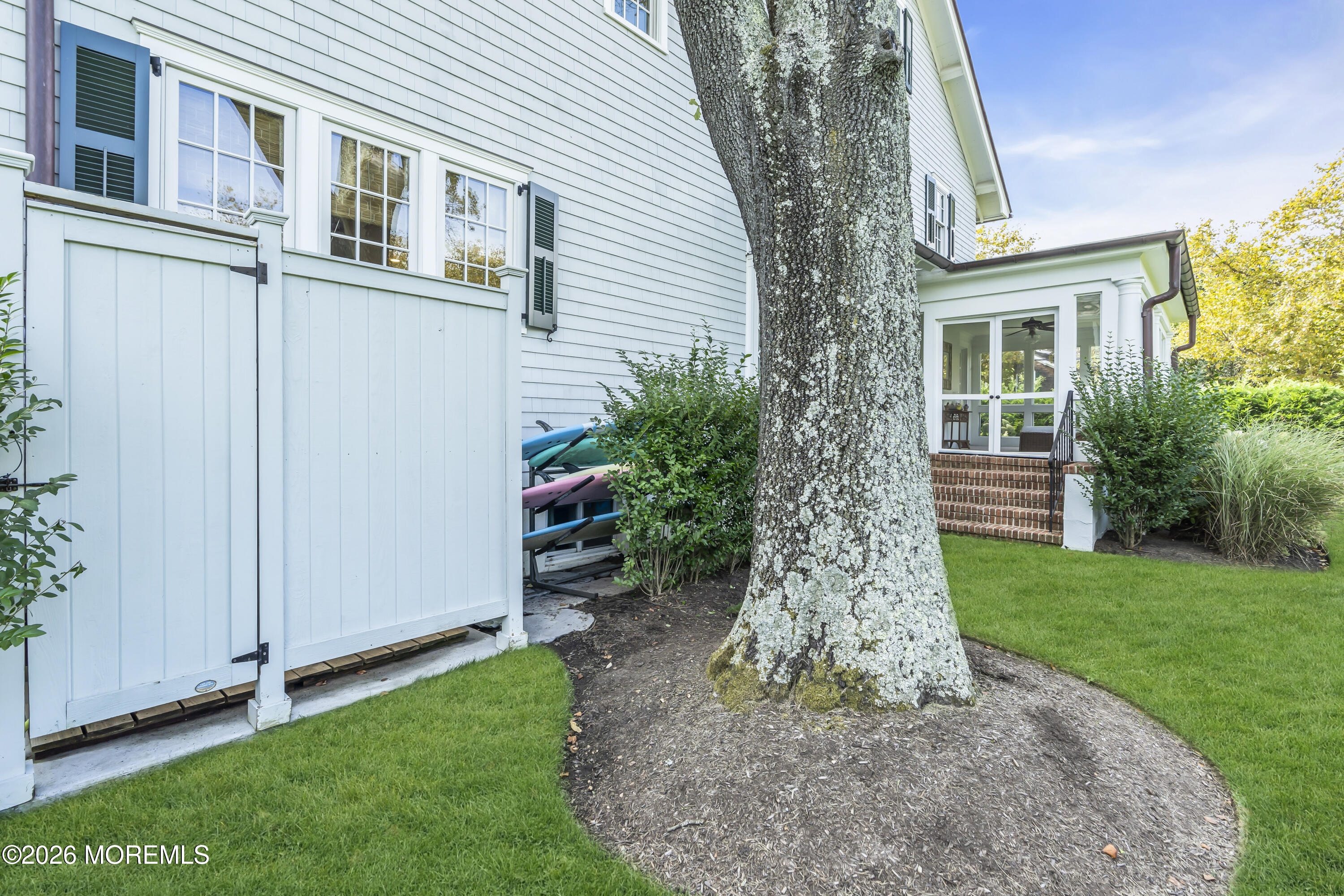 117 Madison Avenue Spring Lake, NJ 07762 - Photo 21 of 96 a front view of a house with a garden