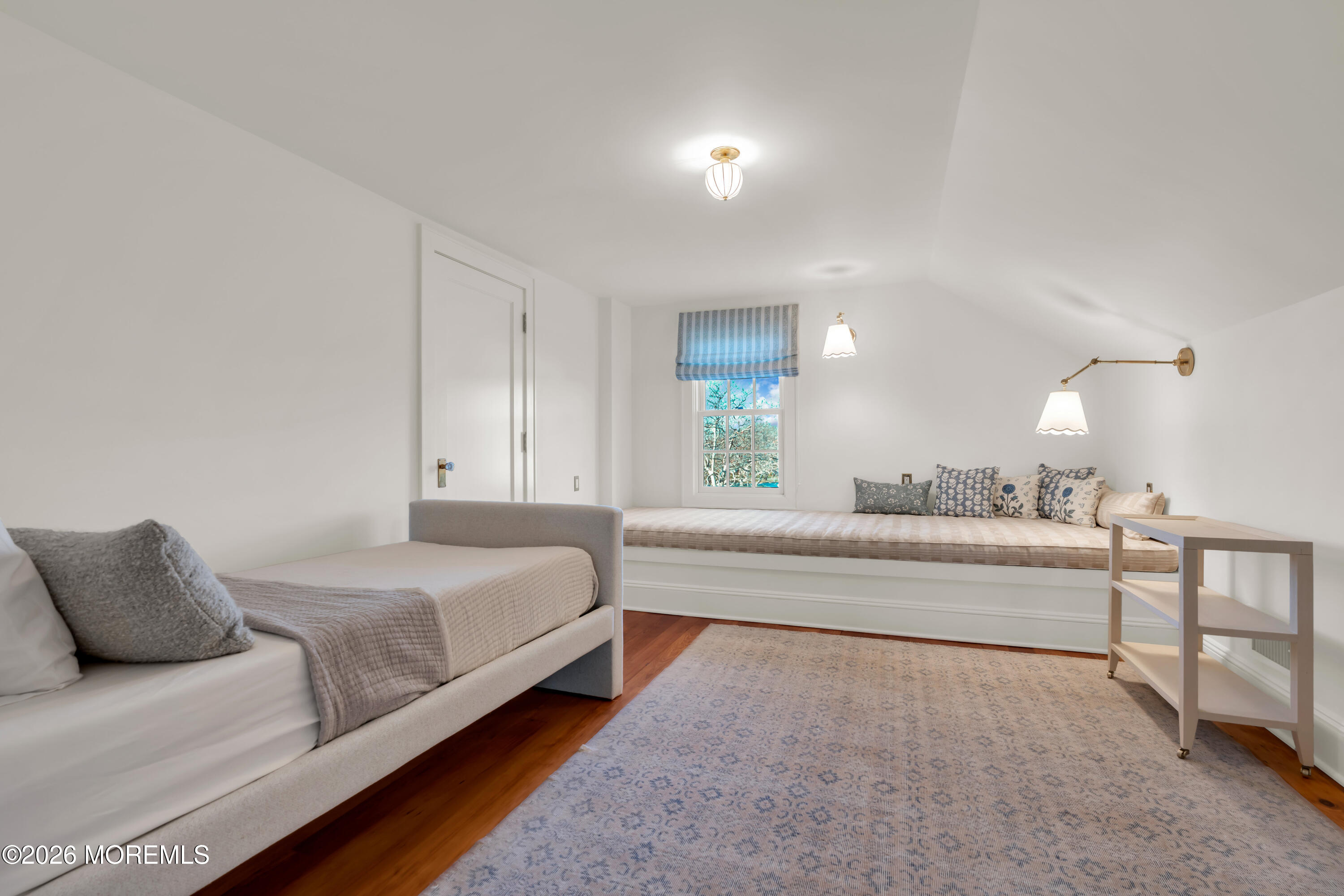 117 Madison Avenue Spring Lake, NJ 07762 - Photo 6 of 96 a spacious bedroom with a bed and a couch