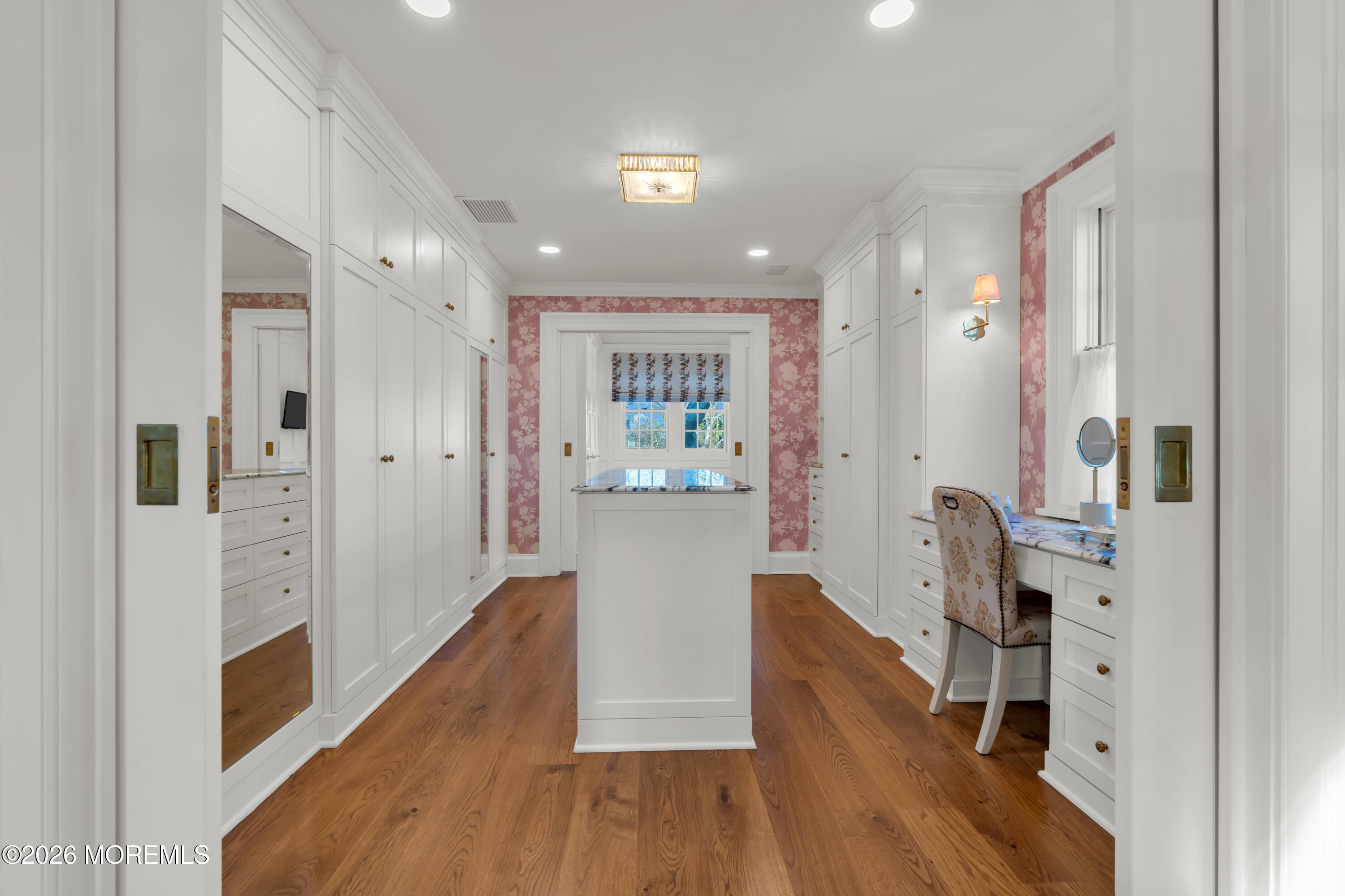 117 Madison Avenue Spring Lake, NJ 07762 - Photo 86 of 96 a view of a hallway with wooden floor and a living room