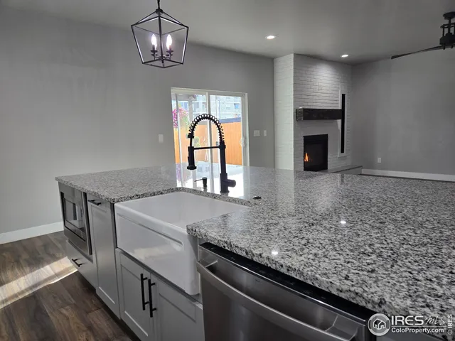 a view of a kitchen with a sink and a stove