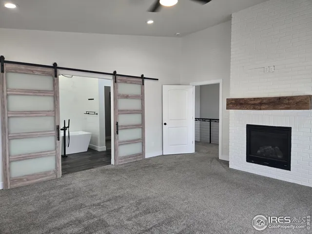 a view of empty room with a fireplace and cabinet