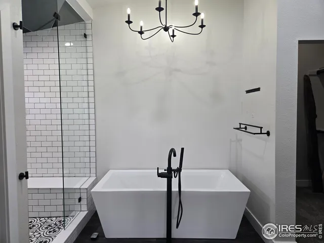 a bathroom with a sink a bathtub and shower