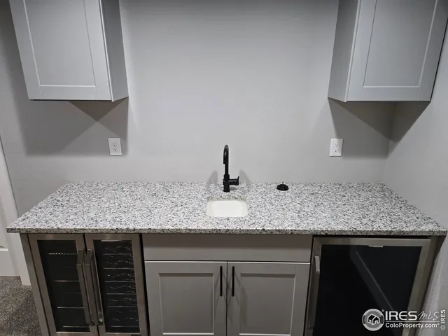a kitchen with a sink and cabinets