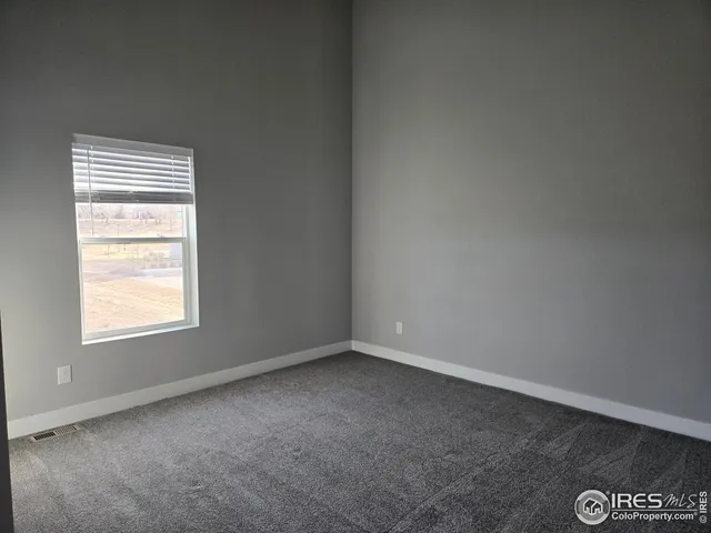 a view of kitchen and refrigerator