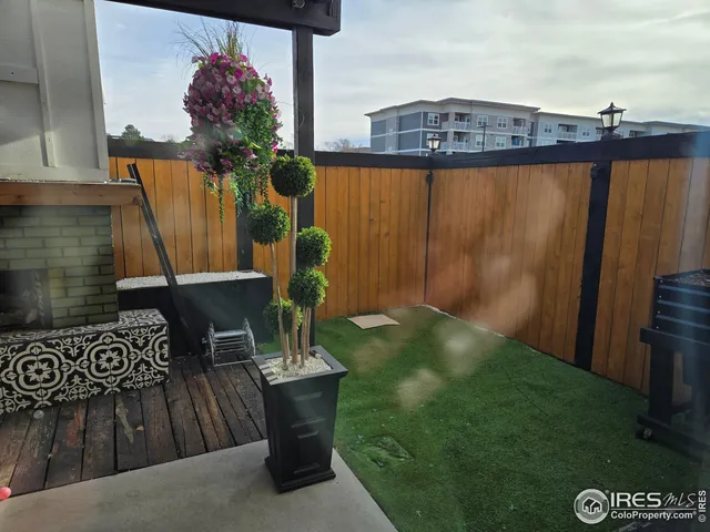 a view of a chairs and table in the patio