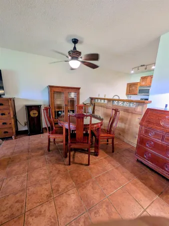 a view of a livingroom with furniture and chandelier