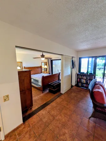 a bed room with a bed and a chair