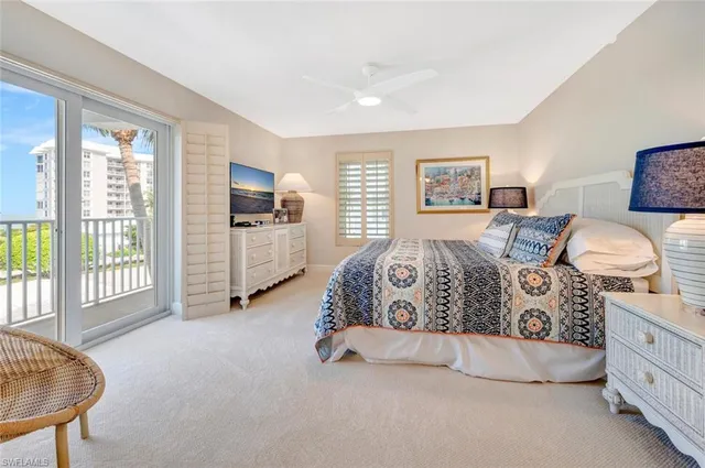 a spacious bedroom with a bed and furniture