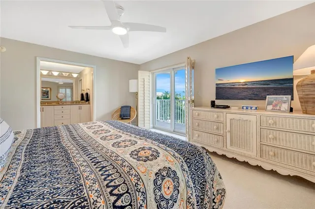 a spacious bedroom with a large bed and a dresser