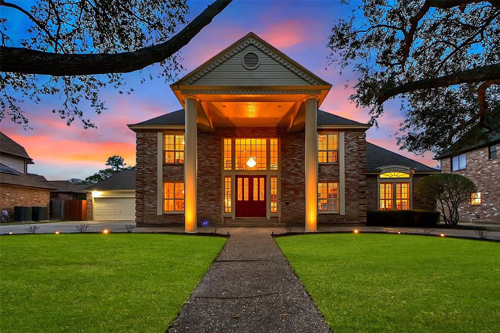 1407 Hannington Drive Katy, TX 77450 - Photo 1 of 50 a view of a house with a small yard and a large tree