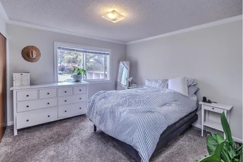 a room with a stove and a refrigerator