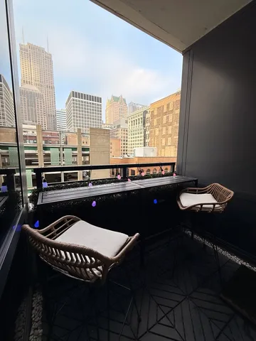 a kitchen that has a sink and a chair