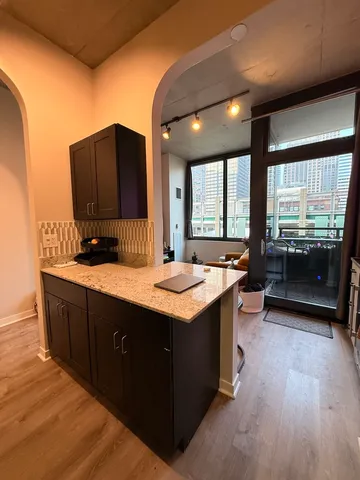 a kitchen with sink and cabinets
