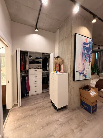 a view of a storage & utility room with closet