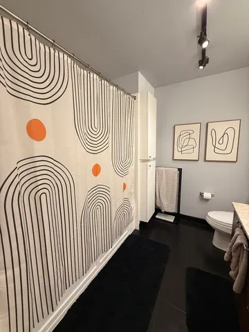 a view of a room that has a table and chair